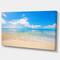 Designart - Large Clouds Over Calm Beach - Seashore Photo Canvas Print